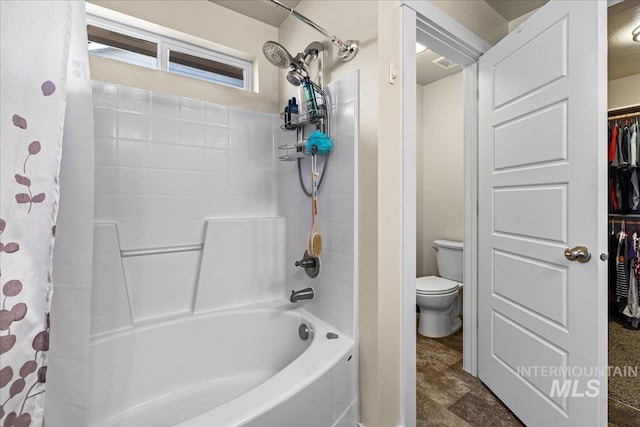 bathroom with visible vents, toilet, and shower / bath combination with curtain