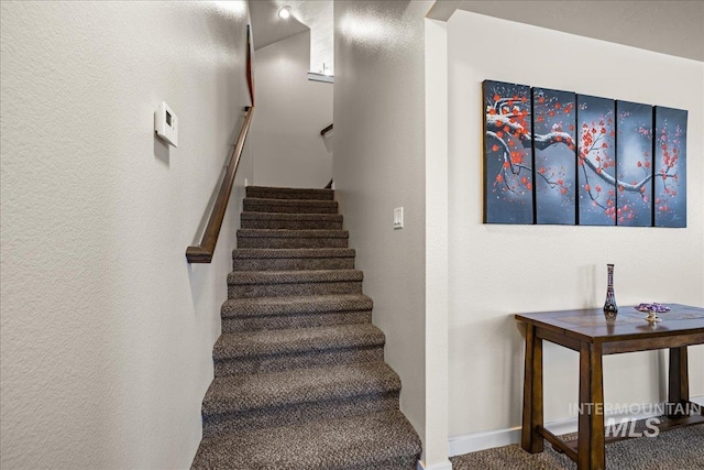 stairway with a textured wall