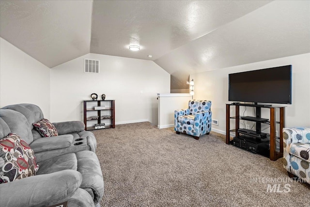 carpeted living area with visible vents, baseboards, a textured ceiling, and vaulted ceiling