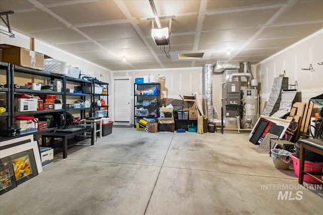 garage featuring gas water heater and a garage door opener