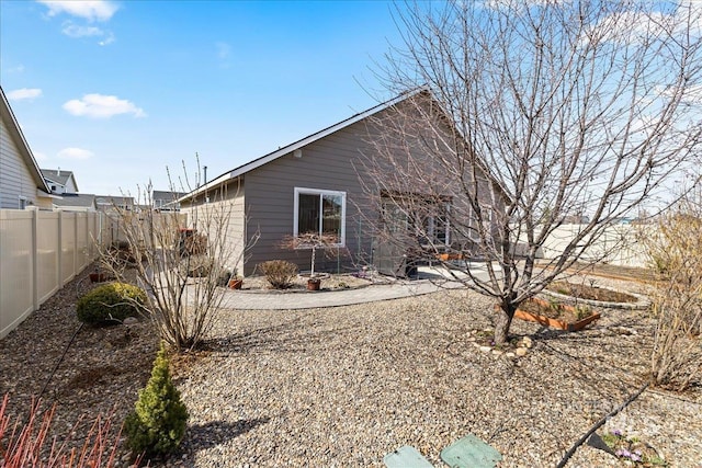 view of property exterior with fence