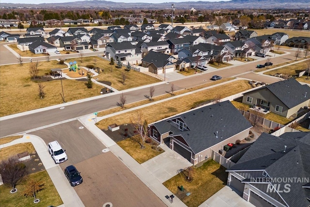 drone / aerial view with a residential view and a mountain view