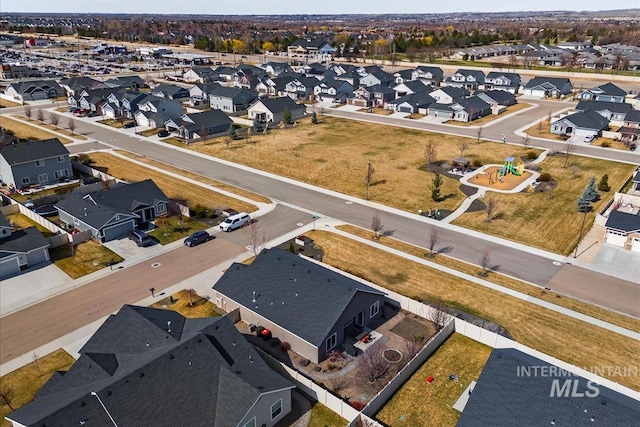 birds eye view of property with a residential view