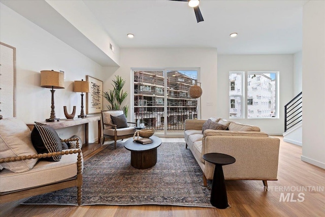 2031 S Makar Ln, Boise, ID 83706 - living area featuring stairs, healthy amount of natural light, wood finished floors, ceiling fan, and recessed lighting