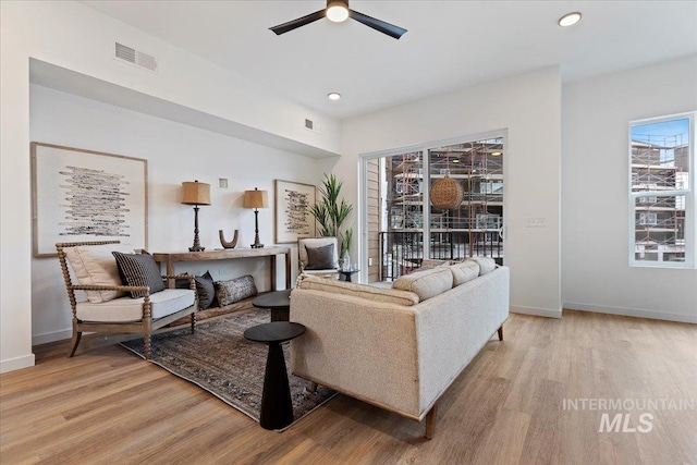2031 S Makar Ln, Boise, ID 83706 - living area featuring light wood-style floors, ceiling fan, baseboards, and recessed lighting