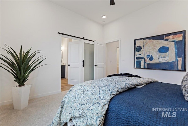 2031 S Makar Ln, Boise, ID 83706 - bedroom with carpet floors, a barn door, baseboards, and ceiling fan