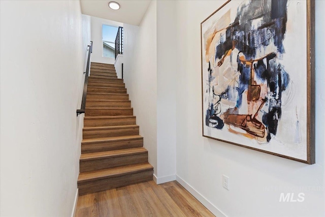 2031 S Makar Ln, Boise, ID 83706 - staircase with wood finished floors and baseboards
