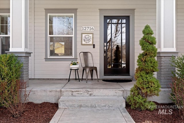 entrance to property with covered porch