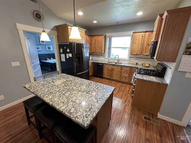 805 W Arbor Pointe Way, Nampa, ID 83686 - kitchen featuring refrigerator with ice dispenser, dishwasher, a sink, light stone counters, and dark wood-type flooring