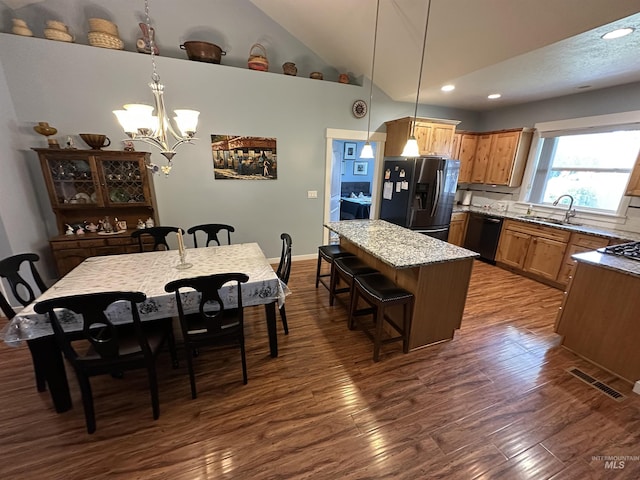 805 W Arbor Pointe Way, Nampa, ID 83686 - kitchen with stainless steel fridge with ice dispenser, a sink, dishwasher, dark wood-type flooring, and a chandelier