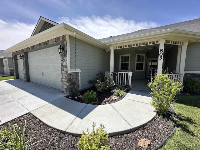 805 W Arbor Pointe Way, Nampa, ID 83686 - view of side of home featuring a garage, covered porch, driveway, and stone siding