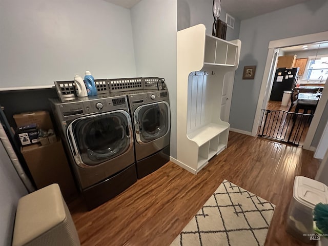 805 W Arbor Pointe Way, Nampa, ID 83686 - washroom with washing machine and dryer, wood finished floors, and baseboards