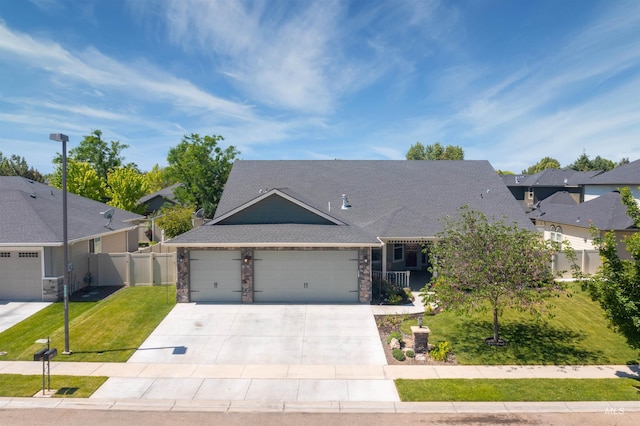 805 W Arbor Pointe Way, Nampa, ID 83686 - view of front of property with an attached garage, stone siding, concrete driveway, roof with shingles, and a residential view