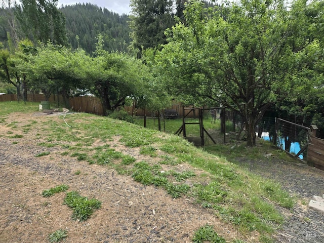 1230 Ellis Ave, Orofino, ID 83544 - view of yard with fence and a wooded view