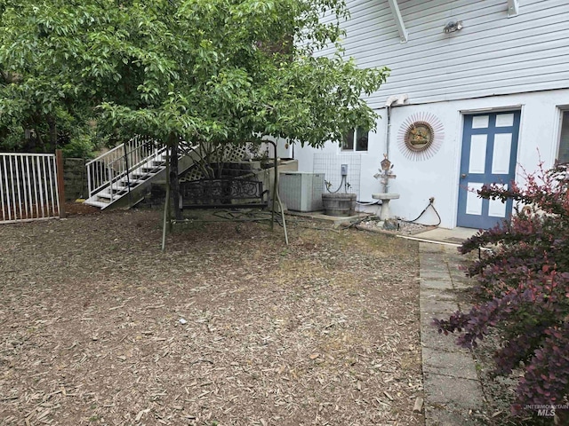 1230 Ellis Ave, Orofino, ID 83544 - view of yard with central AC, stairs, and fence