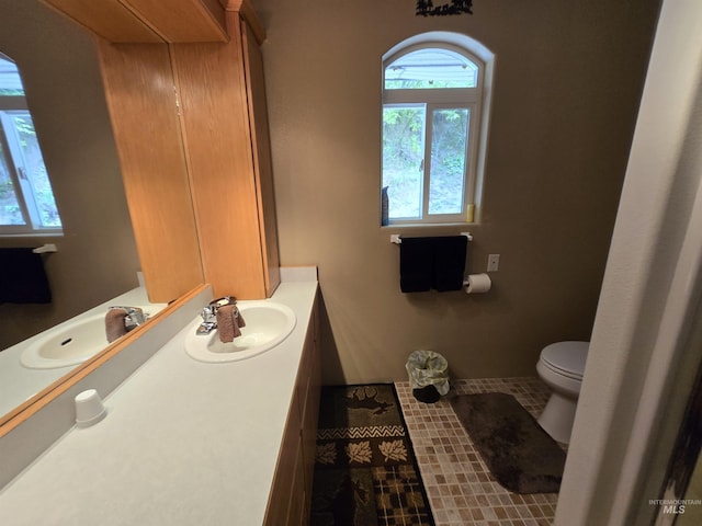 1230 Ellis Ave, Orofino, ID 83544 - bathroom with toilet, vanity, and tile patterned flooring