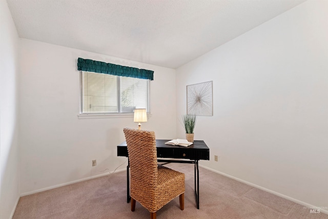 office area featuring light colored carpet and baseboards