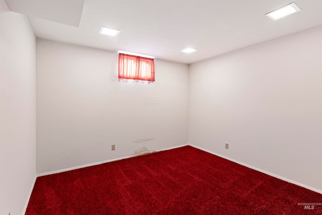 basement featuring carpet and baseboards