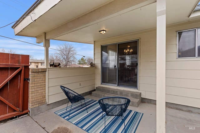 view of patio / terrace featuring entry steps, a gate, and fence