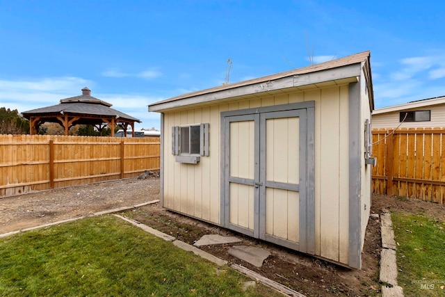 view of shed featuring a gazebo and a fenced backyard