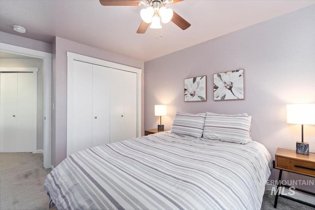 carpeted bedroom featuring a closet and a ceiling fan