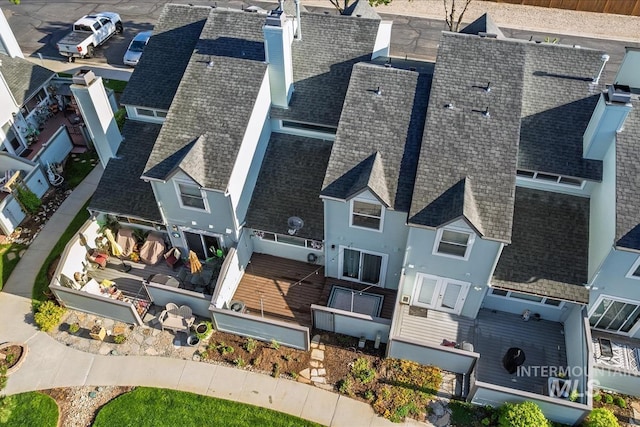 birds eye view of property with a residential view