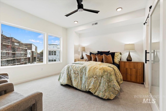 2007 S Makar Ln, Boise, ID 83706 - carpeted bedroom with baseboards, recessed lighting, ceiling fan, and a barn door