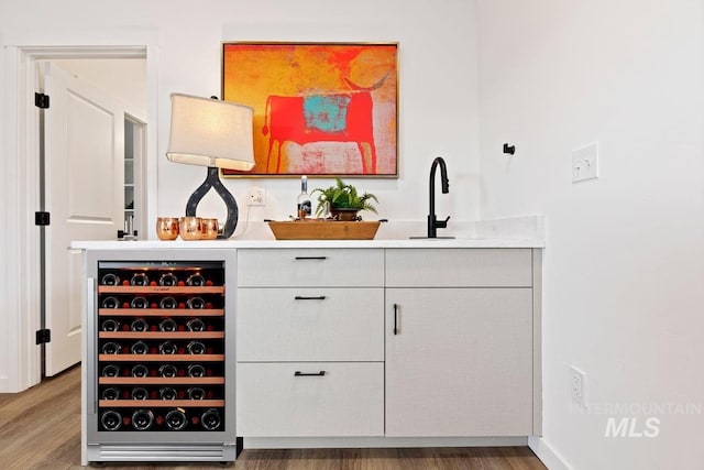 2007 S Makar Ln, Boise, ID 83706 - indoor bar featuring beverage cooler and wood finished floors