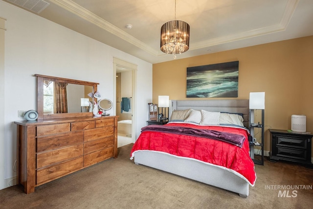 carpeted bedroom featuring visible vents, an inviting chandelier, a tray ceiling, and ornamental molding