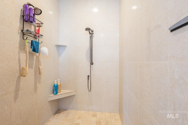 full bath featuring tiled shower