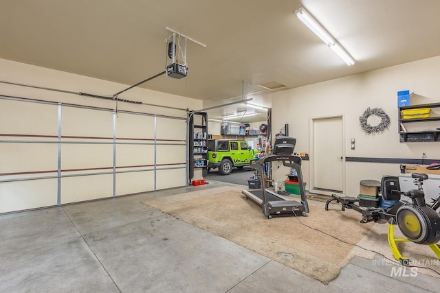 garage featuring a garage door opener