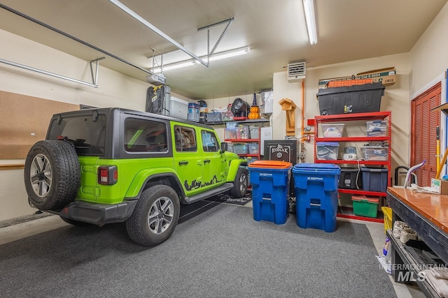 garage featuring a garage door opener