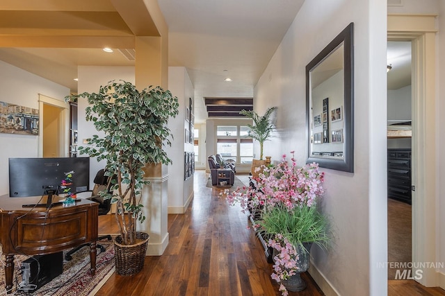 corridor with recessed lighting, wood finished floors, and baseboards