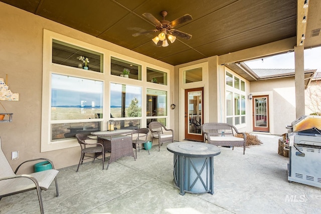 view of patio featuring grilling area and ceiling fan