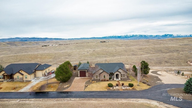 birds eye view of property featuring a mountain view