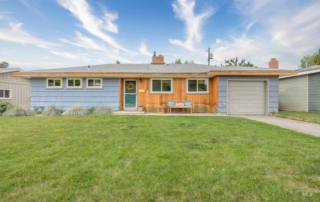 2906 W Kathryn St, Boise, ID 83705 - ranch-style home featuring a chimney, a garage, concrete driveway, and a front yard