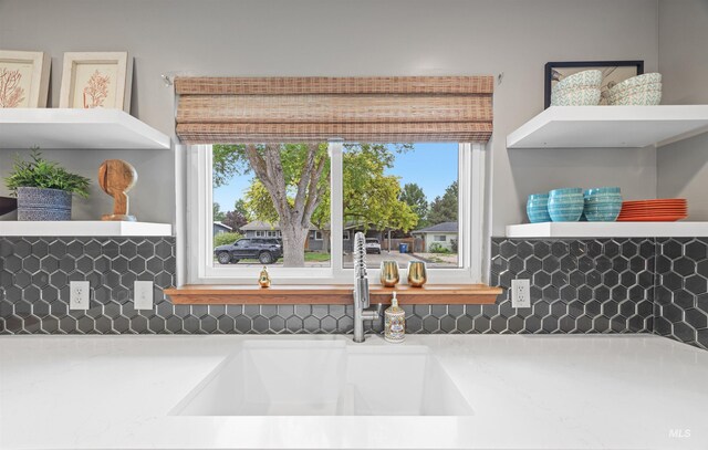 2906 W Kathryn St, Boise, ID 83705 - kitchen view of open shelves, a sink, tasteful backsplash, and light countertops
