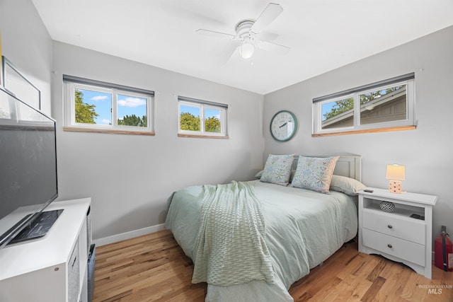 2906 W Kathryn St, Boise, ID 83705 - bedroom with light wood finished floors, baseboards, and a ceiling fan