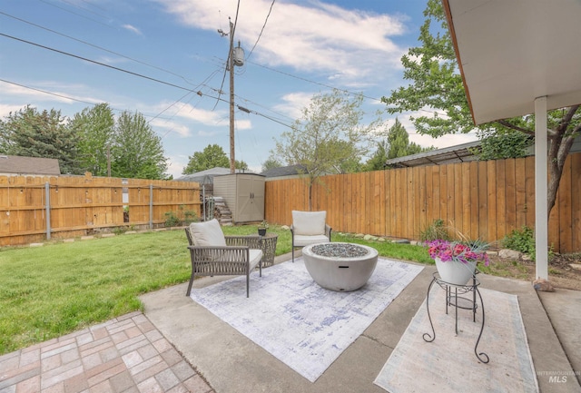 2906 W Kathryn St, Boise, ID 83705 - view of patio featuring a shed, an outbuilding, and an outdoor fire pit