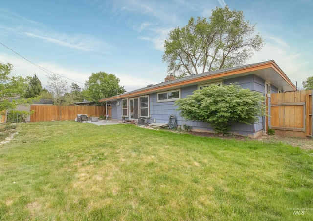 2906 W Kathryn St, Boise, ID 83705 - back of property featuring a patio area, a chimney, and an outdoor hangout area
