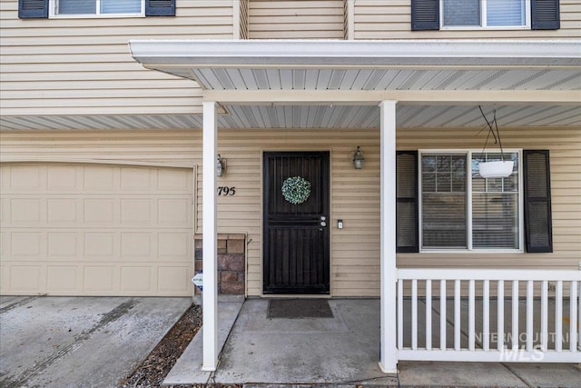 view of exterior entry featuring a garage