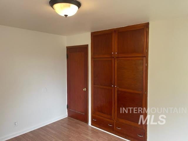 271 Tyler St, Twin Falls, ID 83301 - unfurnished bedroom featuring a closet and wood finished floors