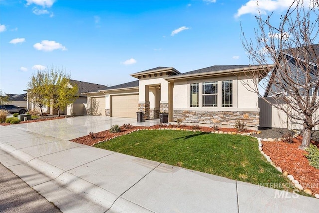 prairie-style home with driveway, stone siding, stucco siding, an attached garage, and a front lawn