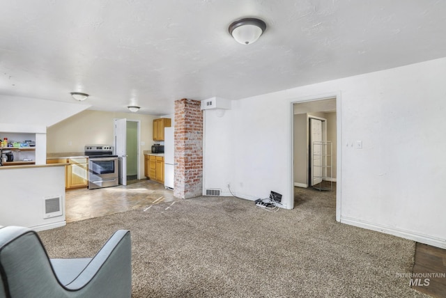 unfurnished living room featuring light carpet, visible vents, and baseboards