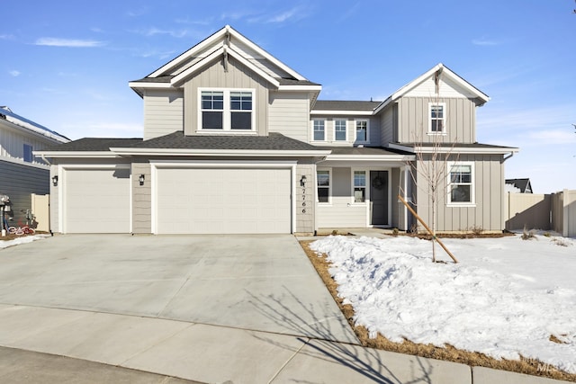 view of front facade with a garage, fence, board and batten siding, and concrete driveway