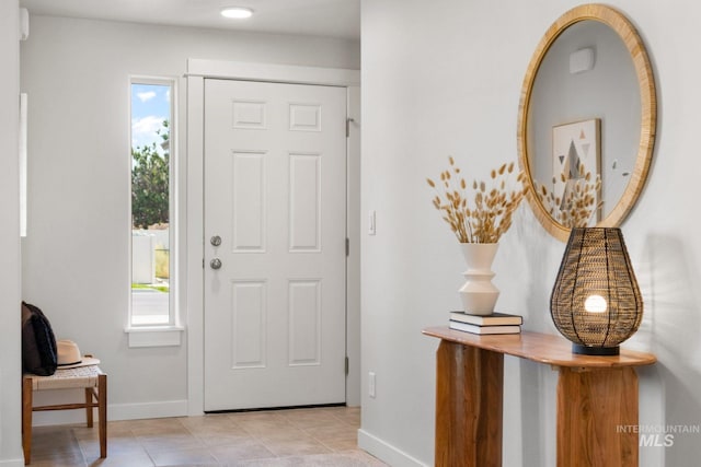 tiled entryway with plenty of natural light