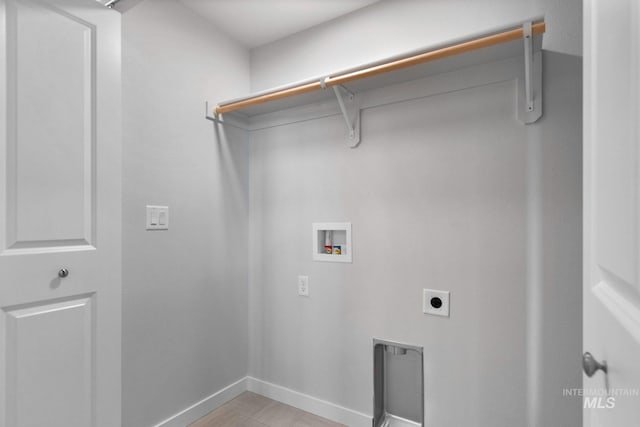 washroom with hookup for a washing machine and hookup for an electric dryer