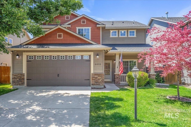 6495 S Mistyglen Ave, Boise, ID 83709 - craftsman house with stone siding, concrete driveway, a garage, and roof with shingles