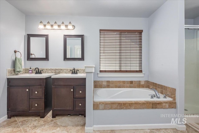 6495 S Mistyglen Ave, Boise, ID 83709 - full bath with two vanities, a stall shower, and a garden tub