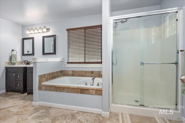 6495 S Mistyglen Ave, Boise, ID 83709 - bathroom featuring vanity, a shower stall, a bath, tile patterned floors, and baseboards